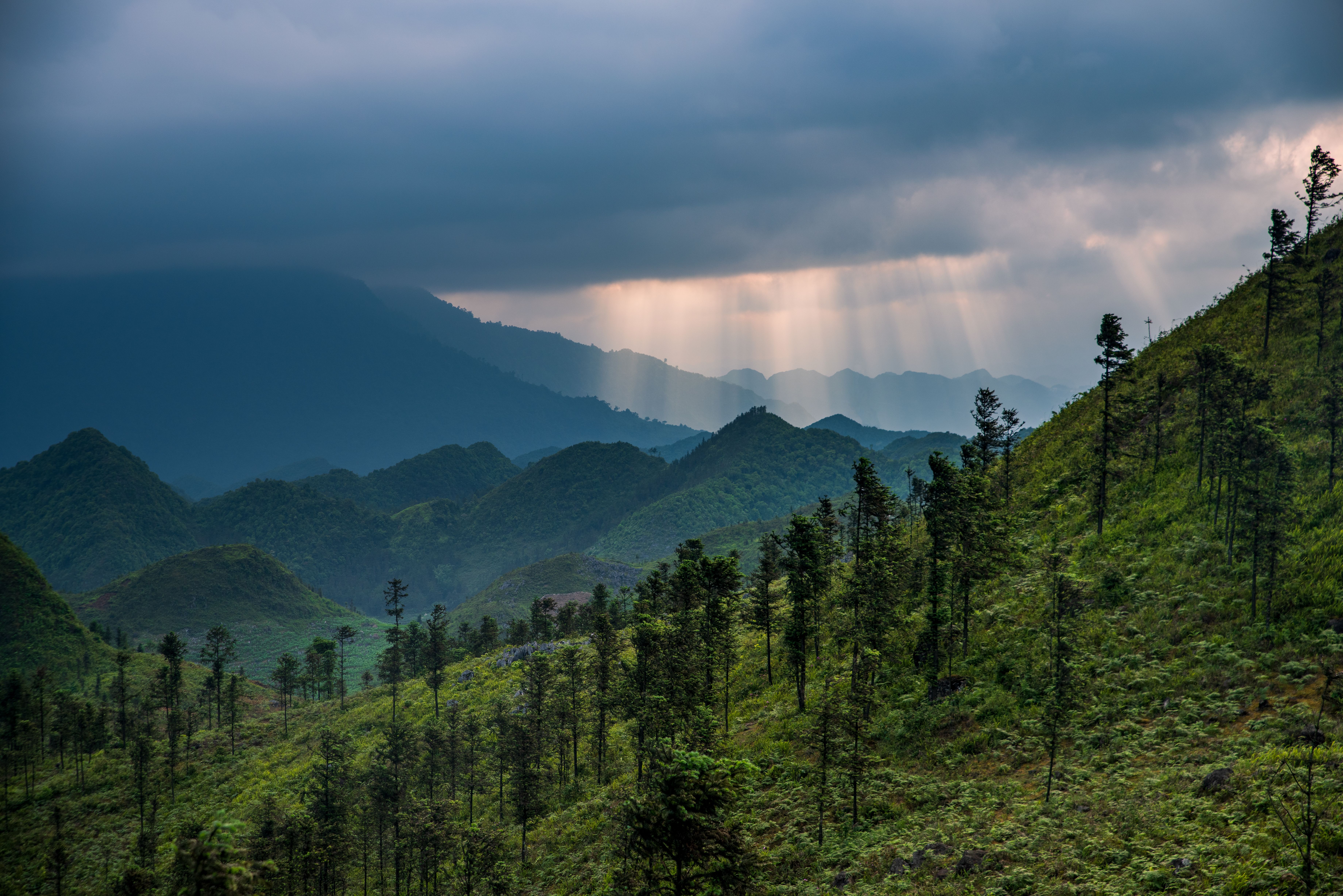 Scenic View of Green Mountains under a Cloudy Sky · Free Stock Photo