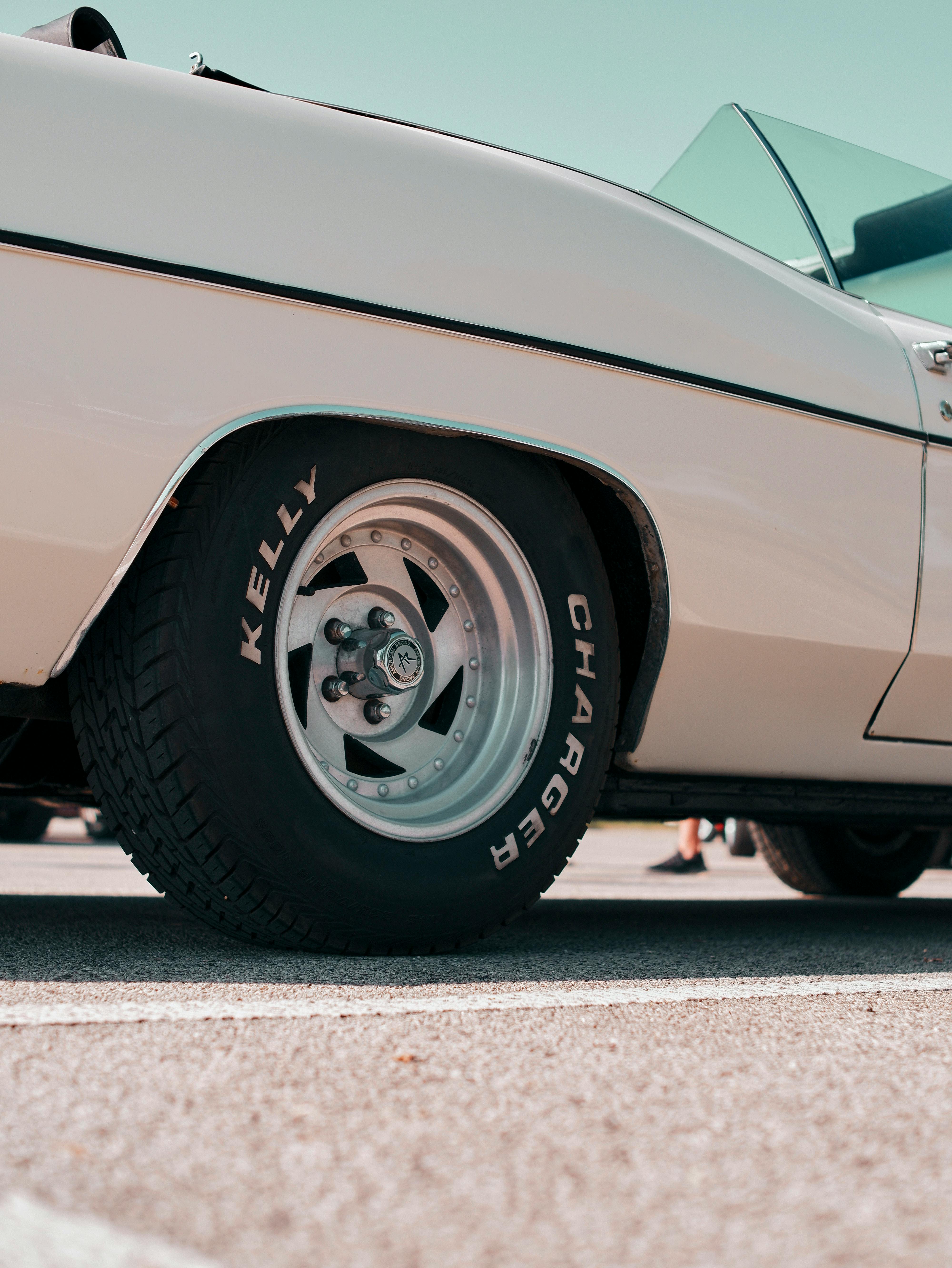 Close-up of a classic car wheel in Bratislava, showcasing vintage automotive design.