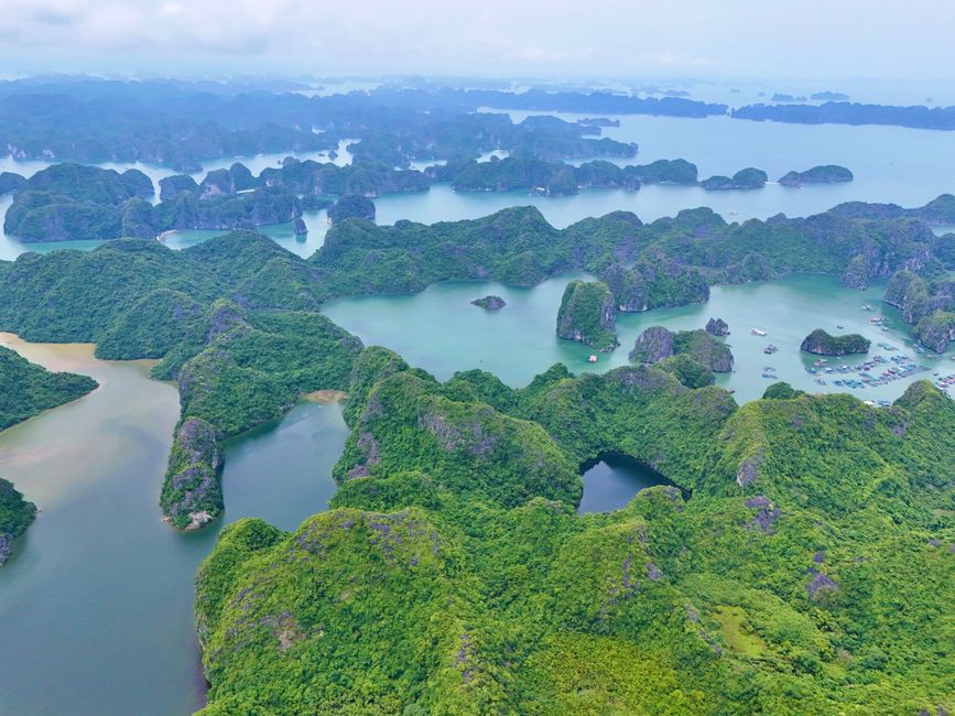 Stunning aerial shot of Ha Long Bay's lush green islands and tranquil waters in Vietnam.