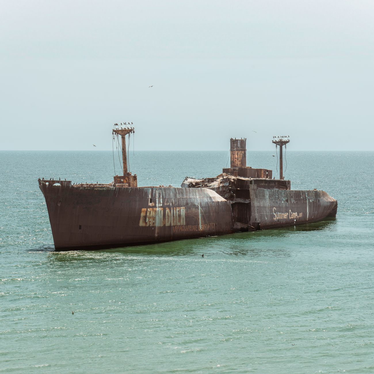 Discover the haunting shipwreck at Costinești on Romania's coastline, resting quietly in the Black Sea.