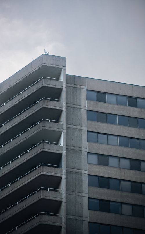 Free A striking modern high-rise with geometric lines, showcasing urban architecture. Stock Photo