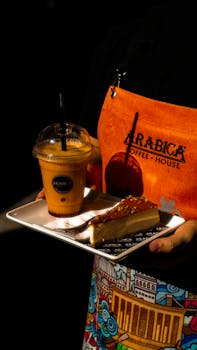 Enjoy a refreshing iced coffee and slice of cake at Arabica Coffee House.
