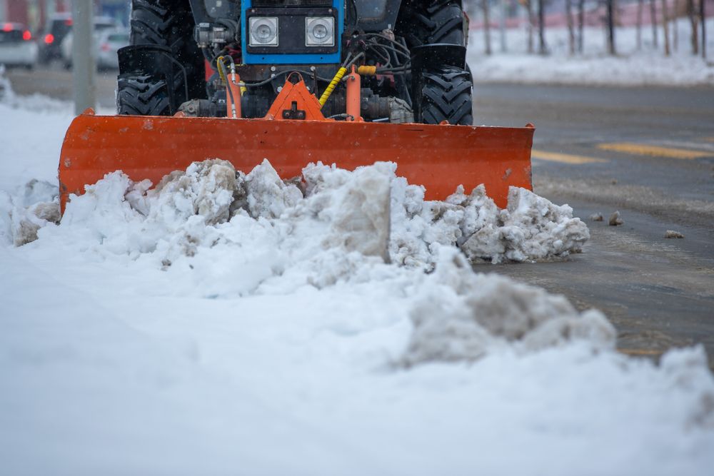 Snow clearing on a city street after a winter storm