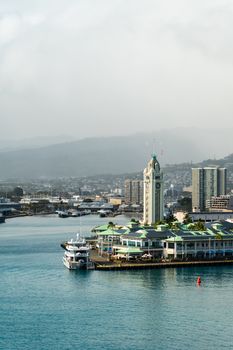 Photo by Donovan Kelly Aerial view of Aloha Tower and the waterfront in Honolulu, showcasing the skyline and harbor.
