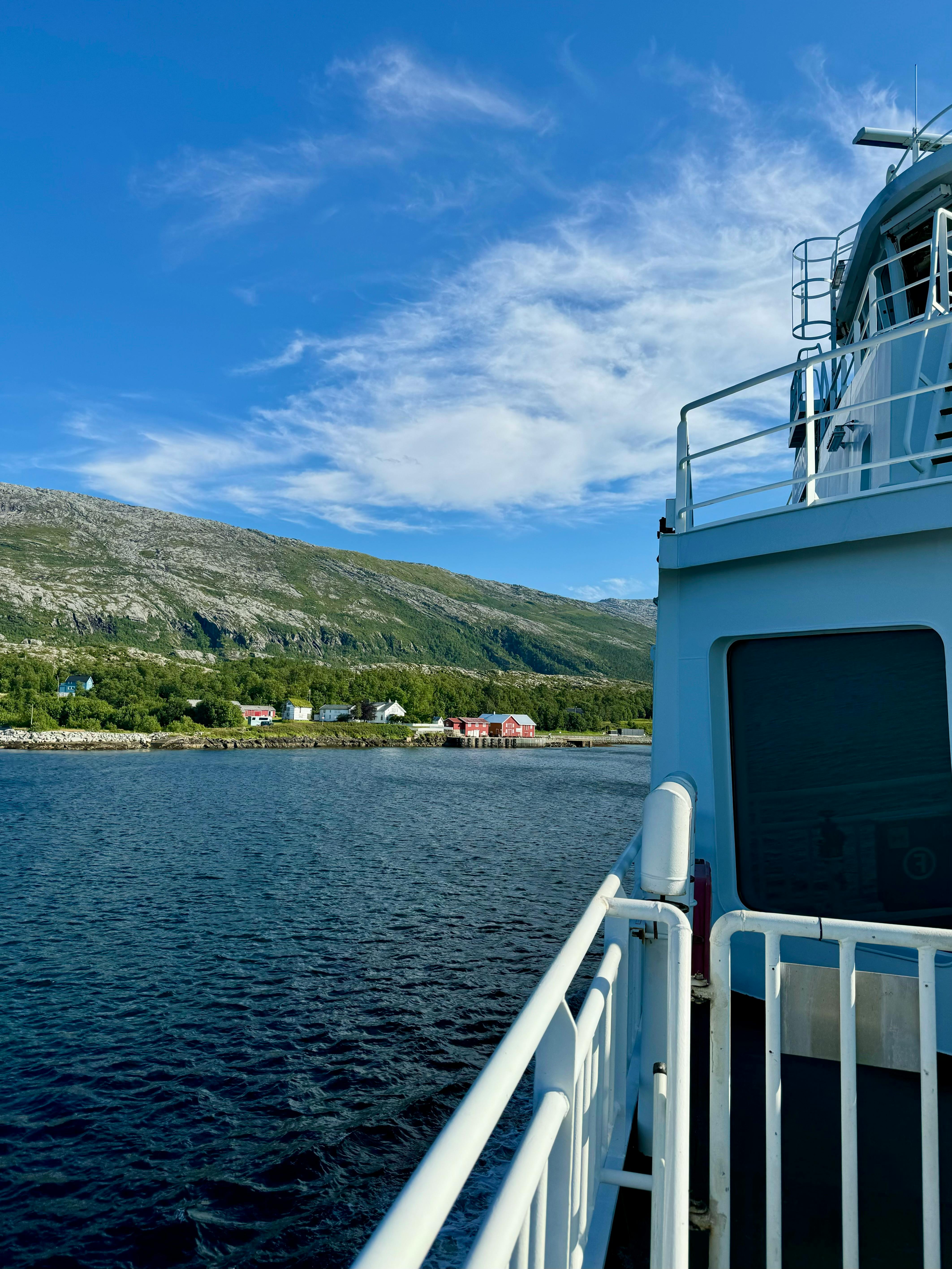 a view of the water from the deck of a ferry