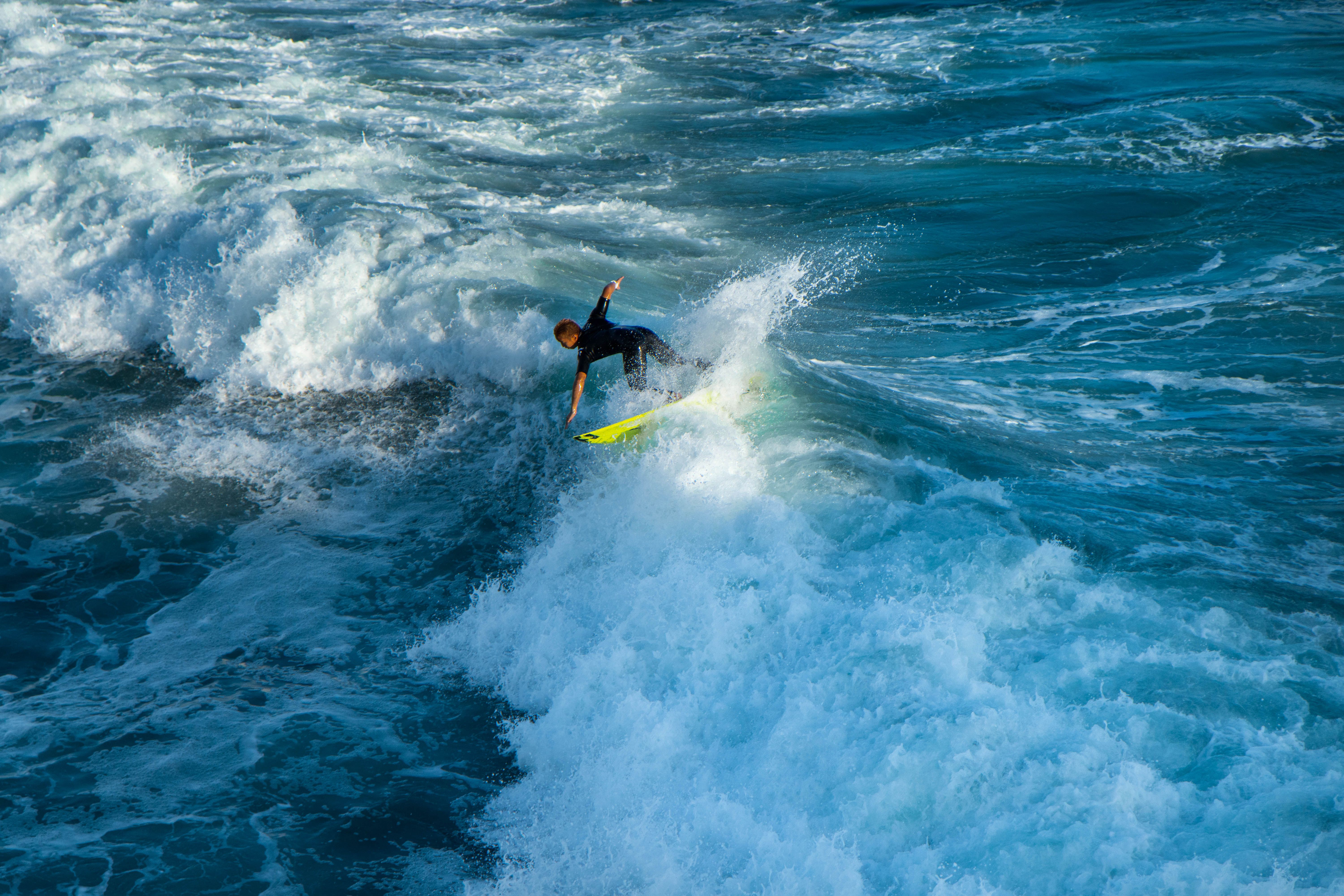 A Person Surfing on the Sea · Free Stock Photo