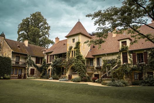Picturesque house with lush garden in Apremont-sur-Allier, France.