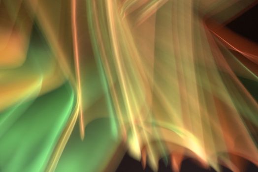Captivating abstract image of colorful light waves creating dynamic patterns.