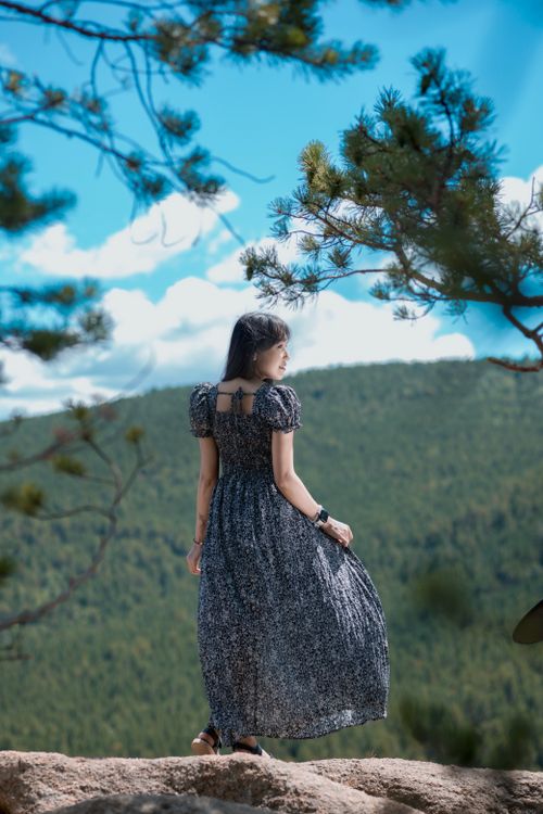 Woman in Blue Maxi Dress Standing on Rock · Free Stock Photo