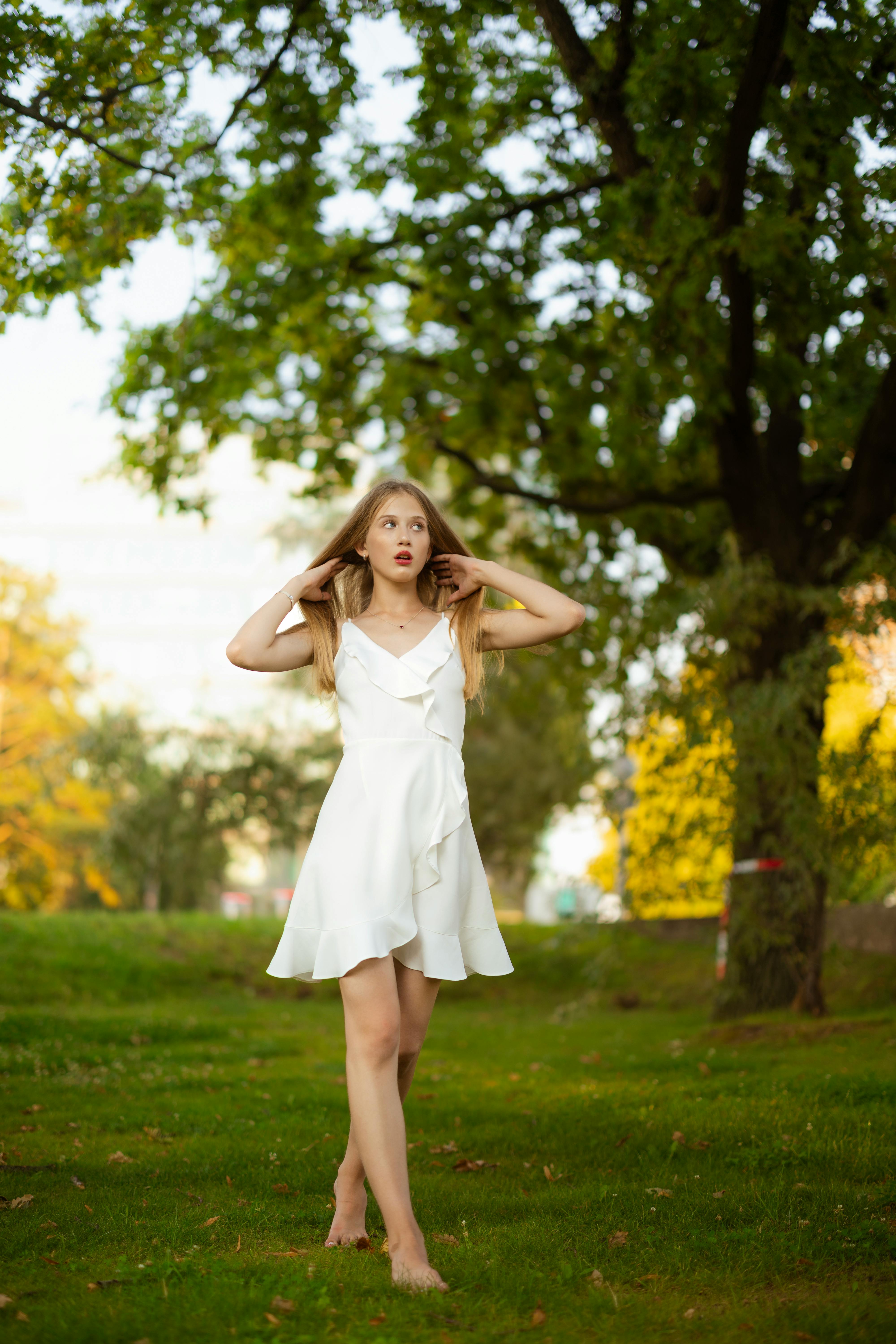 a beautiful blonde woman in a white dress
