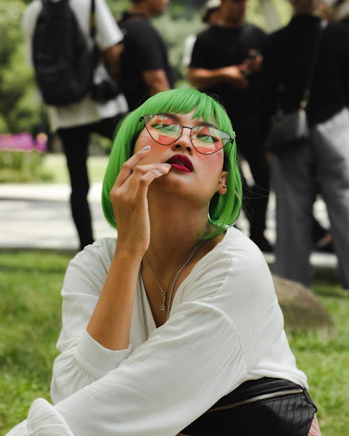 Photo of Woman Wearing Eyeglasses