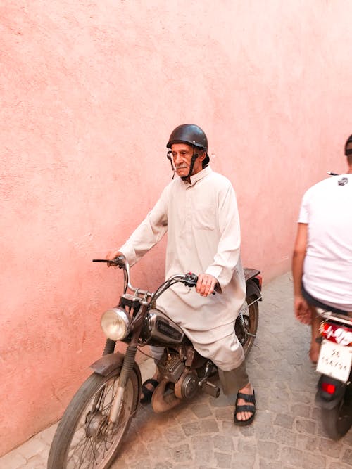 Photo of Man Riding Motorcycle