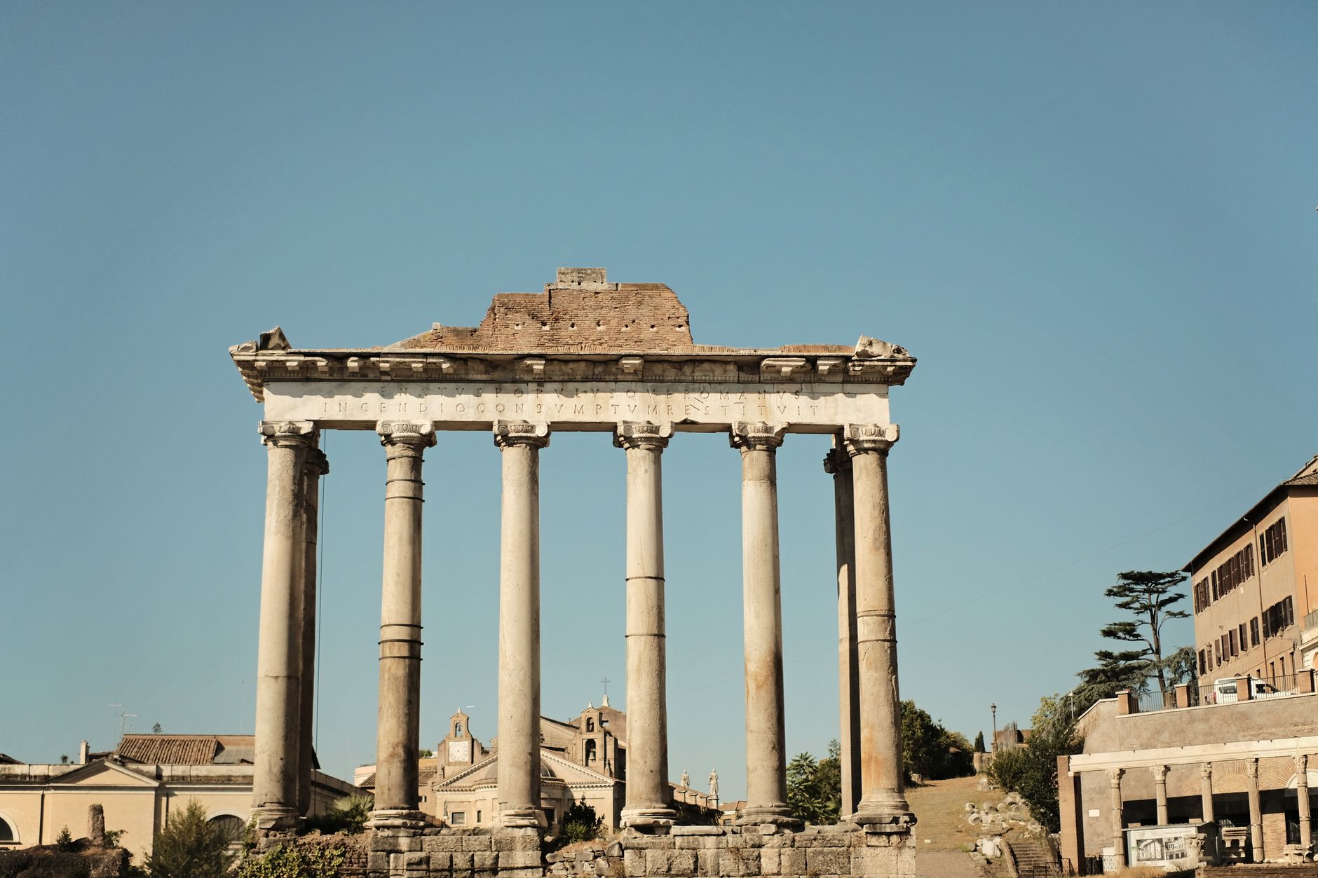 Beautiful ancient Roman columns in the heart of historic Rome on a sunny day.