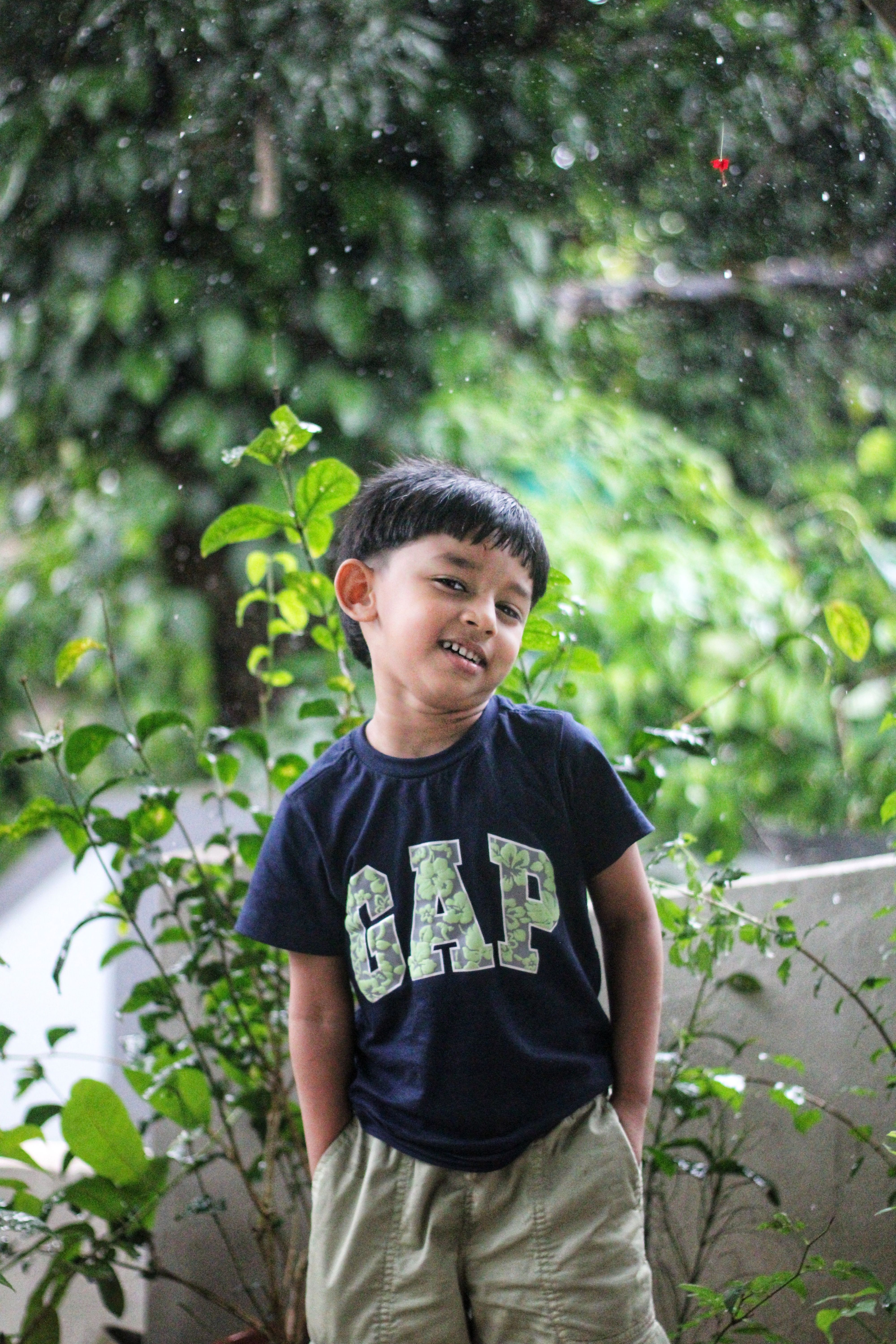 Happy kid enjoying the rain, Happy boy enjoying the rain