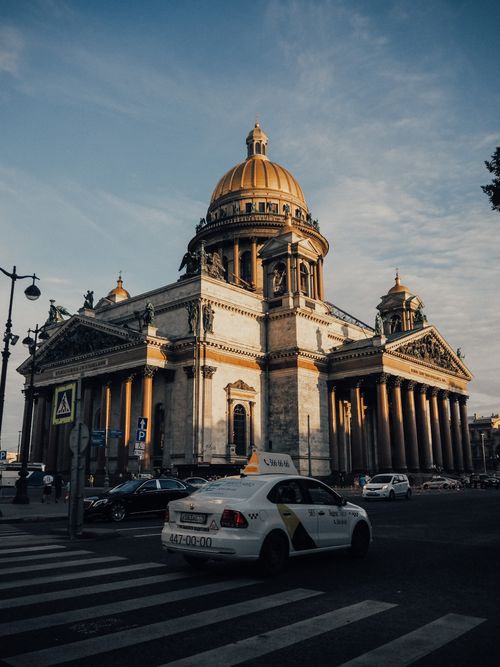 Free Neoclassical architecture of Saint Isaac's Cathedral in Saint Petersburg with street traffic. Stock Photo