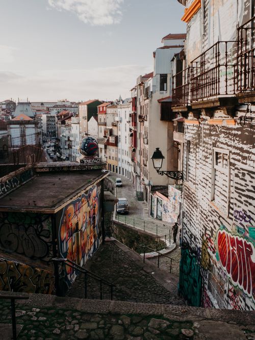 Free Explore vibrant graffiti and urban architecture in a Porto alleyway. Stock Photo