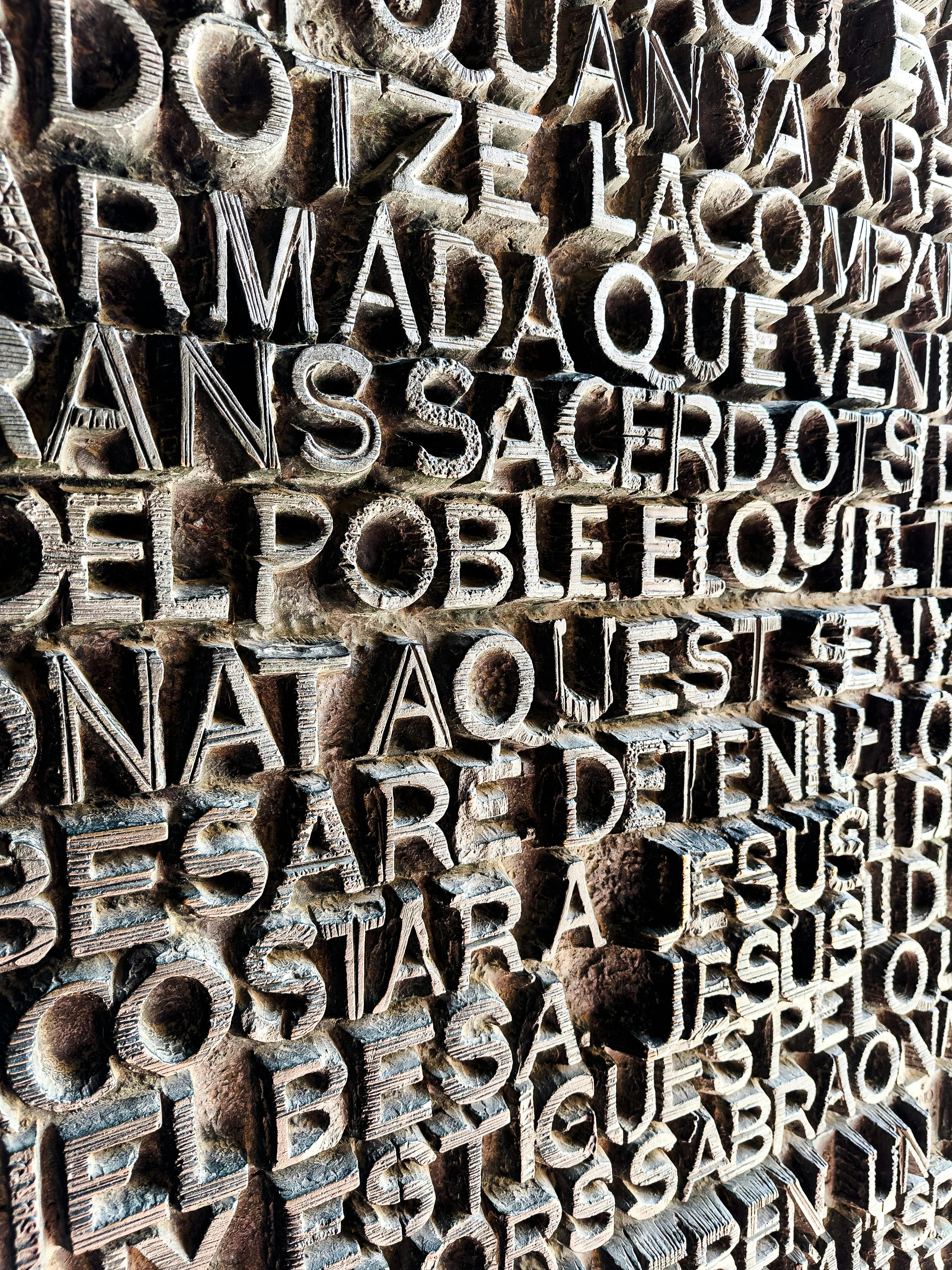 a close up of a wall with many different types of letters