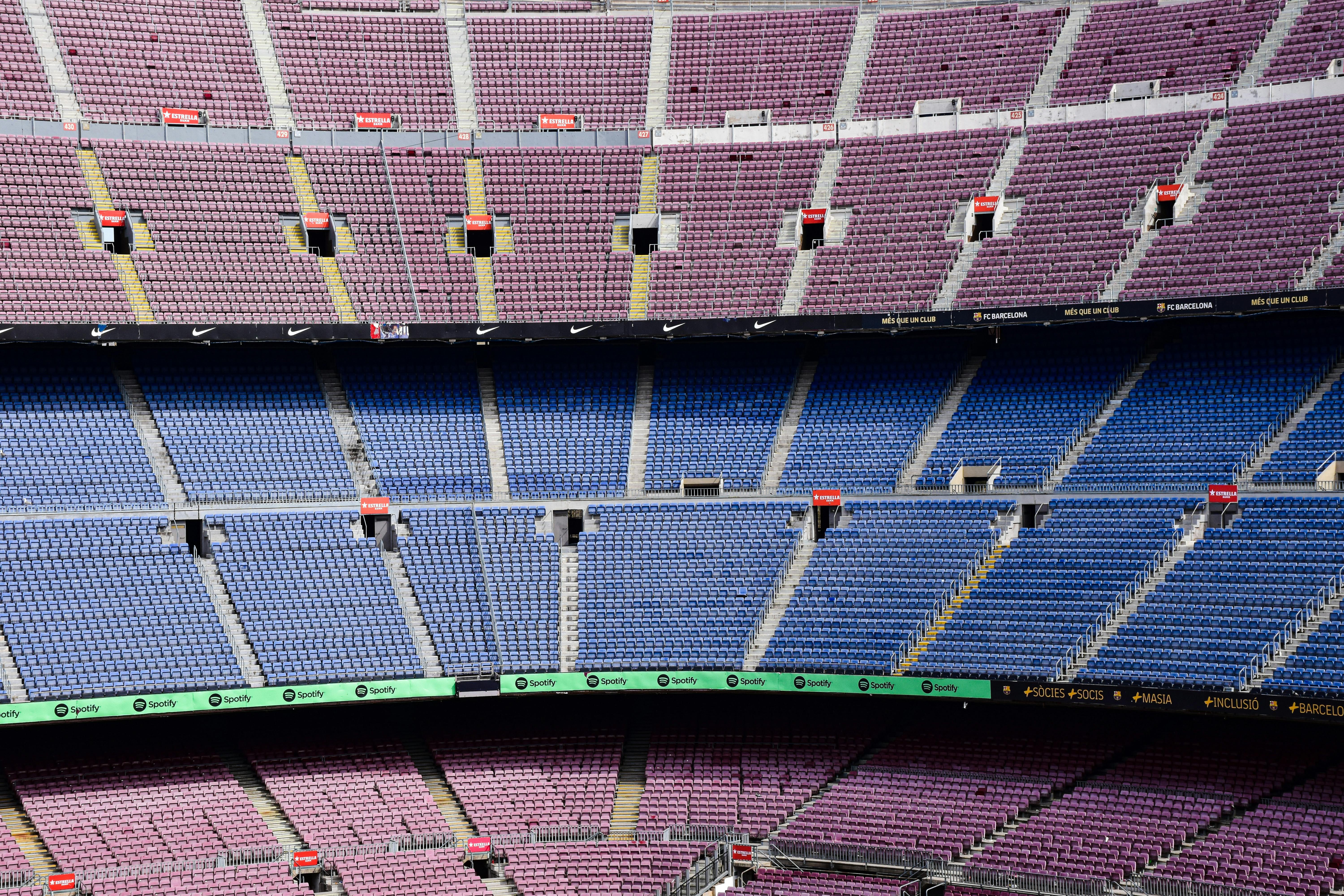 a stadium with blue seats and purple seats