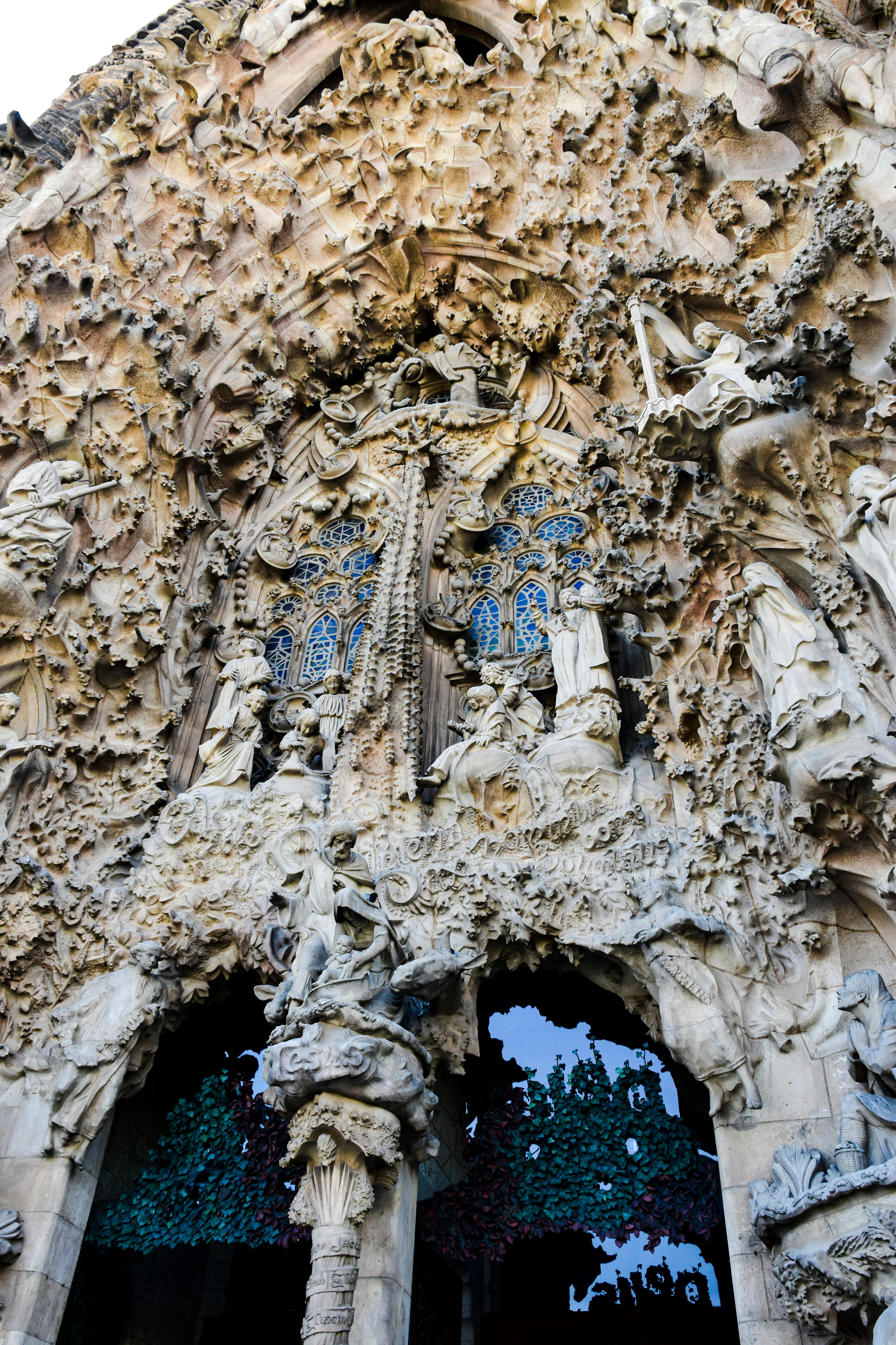 the facade of a building with statues on it