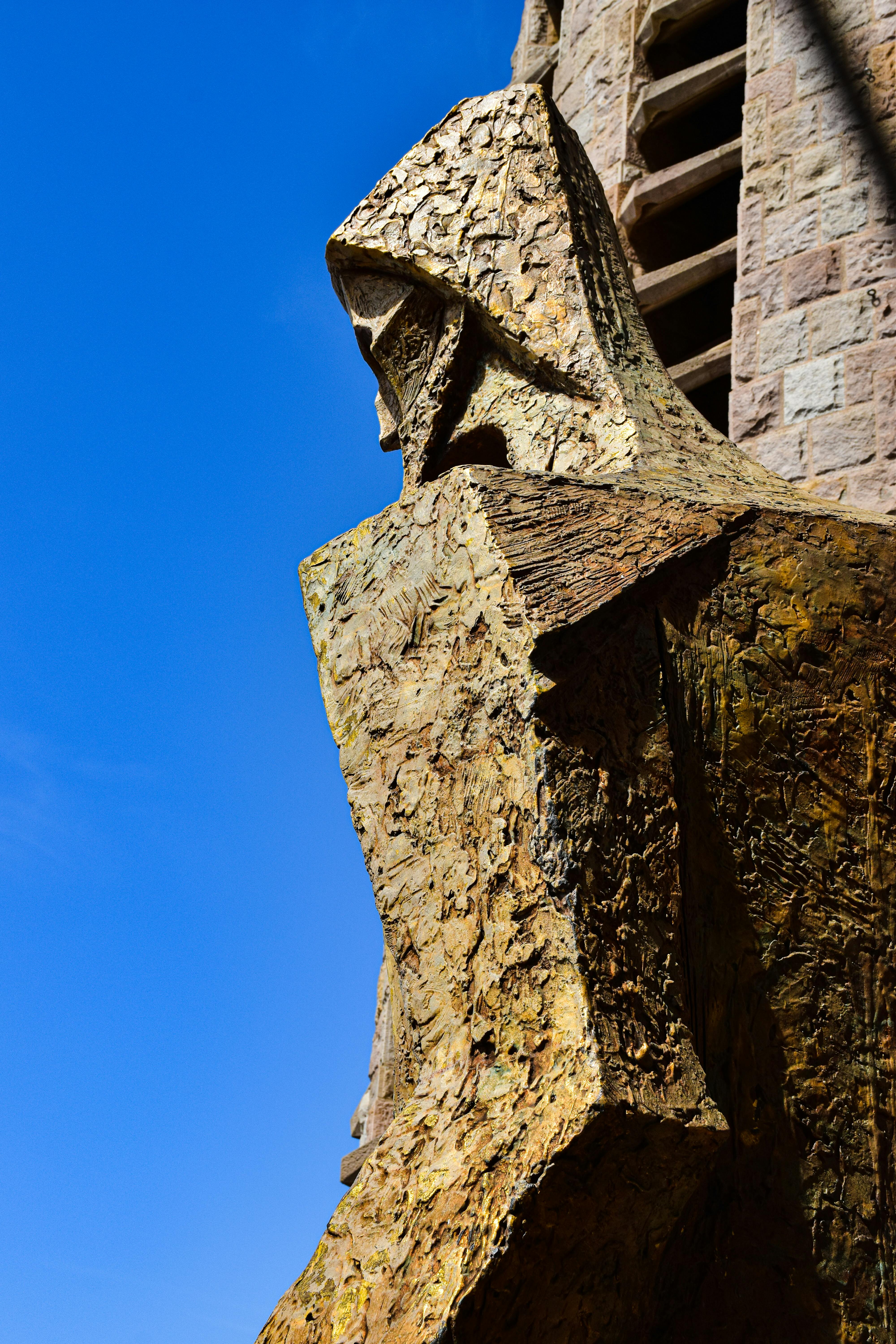 a statue of a man with a large head