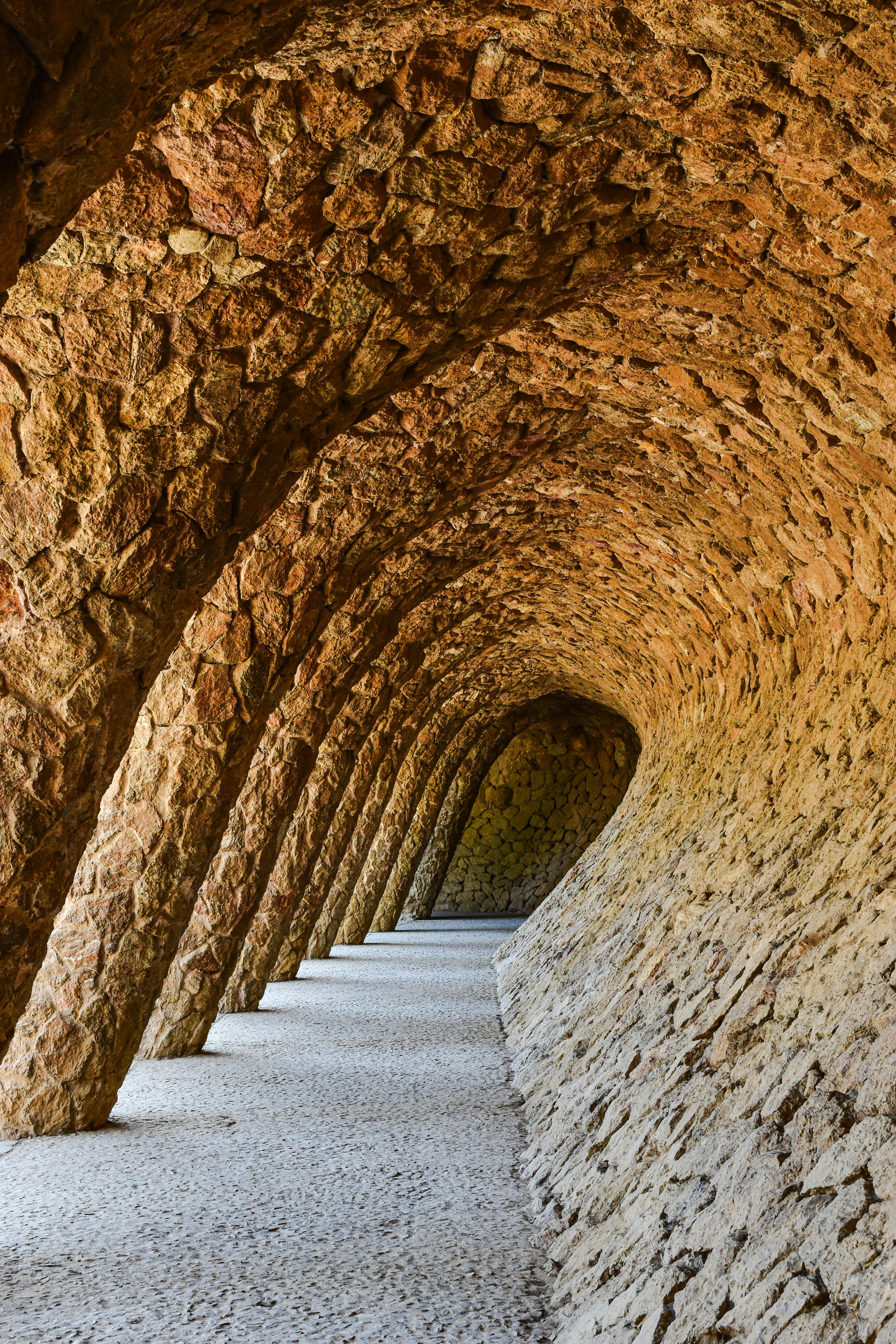 the walkway in the park is made of stone