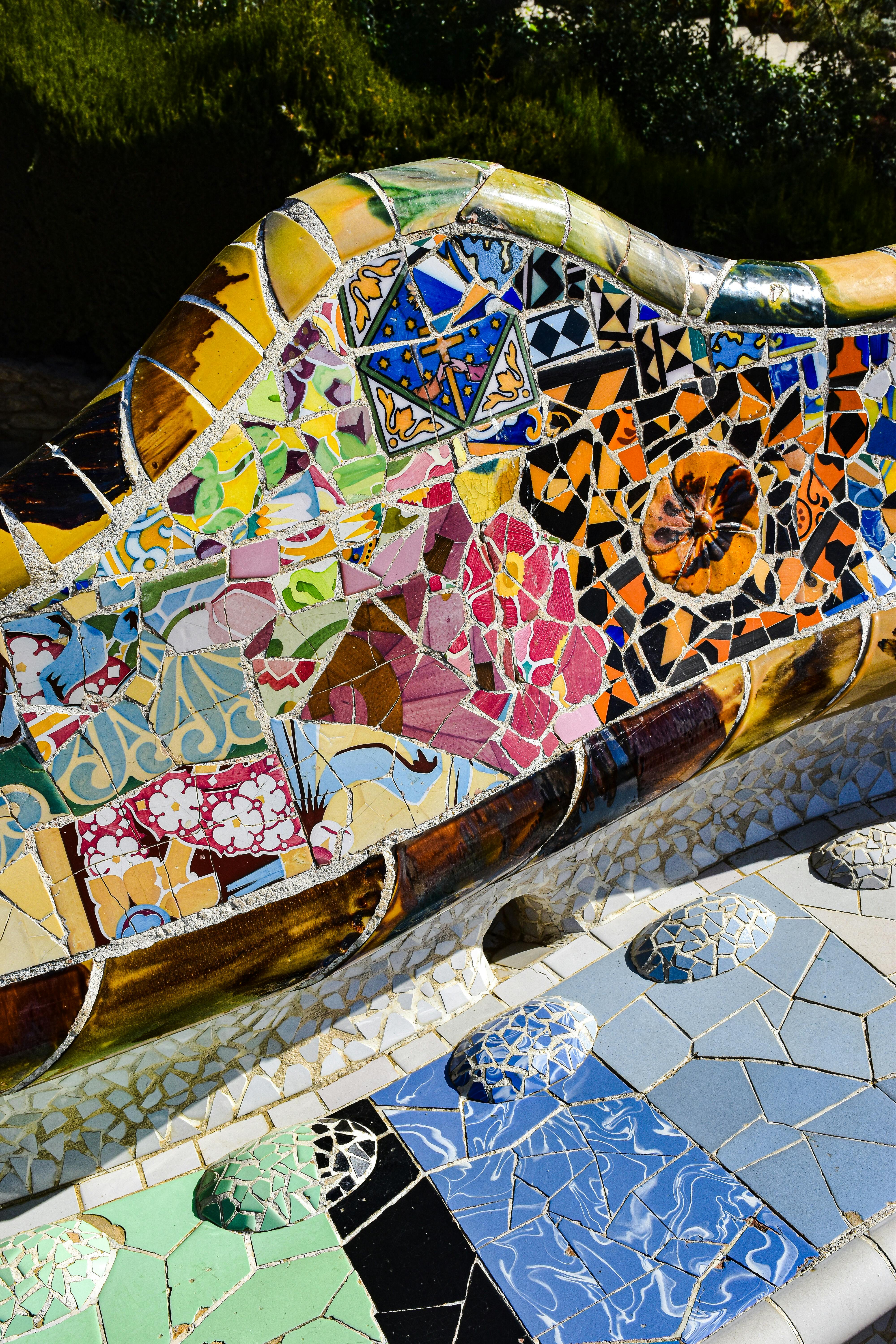 a colorful bench with a mosaic design