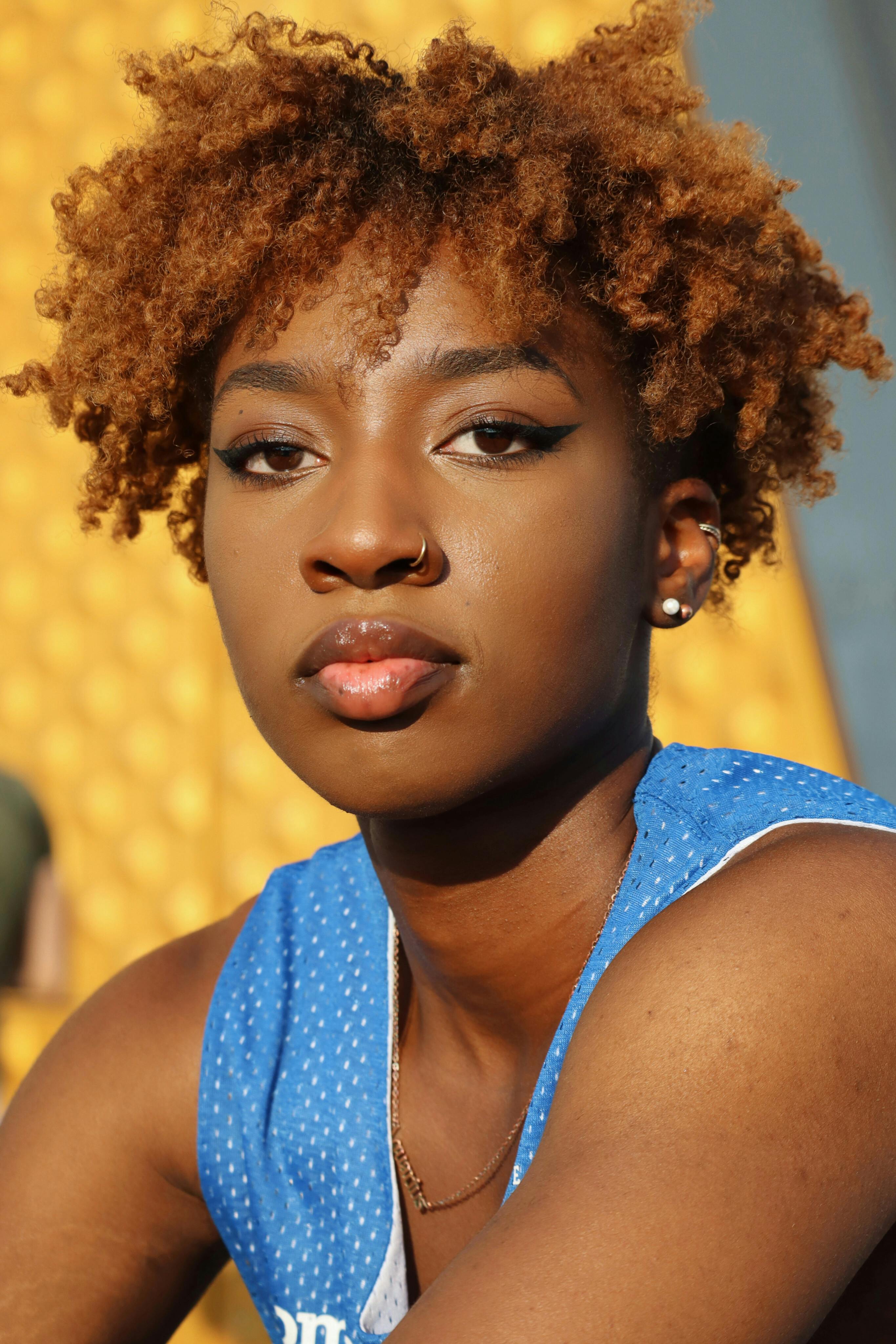 a young woman with an afro hair style