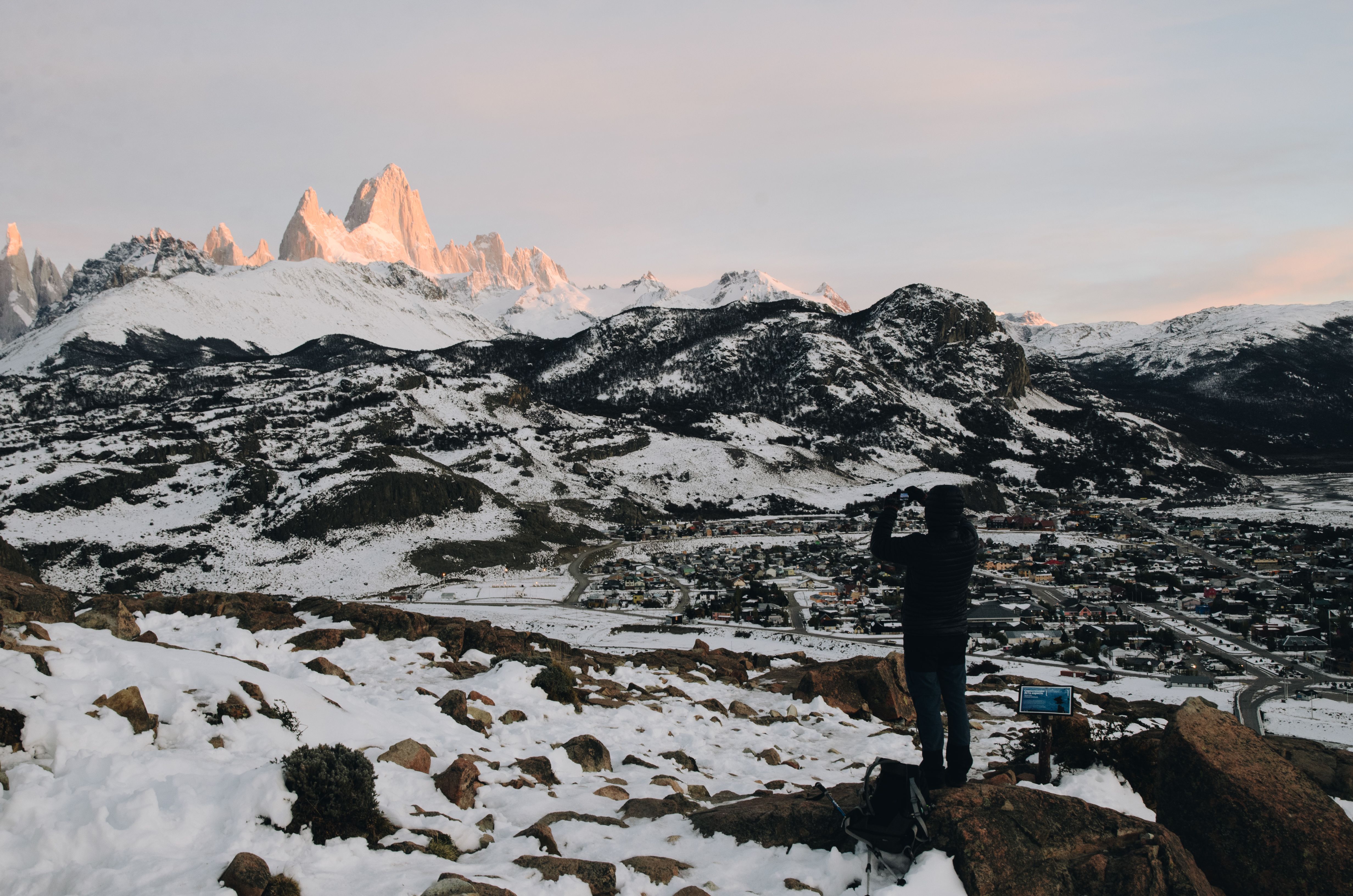 Photographer capturing the stunning snow-capped mountains of El Chaltén, Argentina.