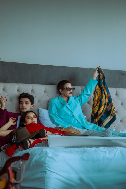 Free Stylish adults lounging in a modern bedroom in Mexico City, embracing relaxed fashion trends. Stock Photo