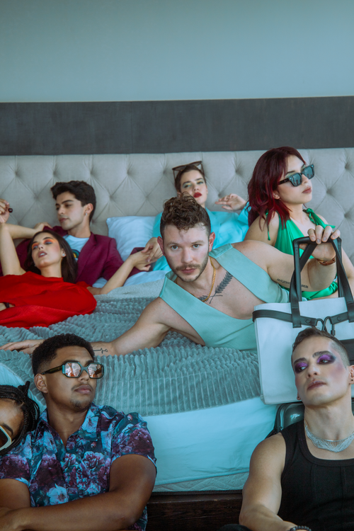 Free Fashion-focused group enjoying leisure time in a modern Ciudad de México bedroom. Stock Photo