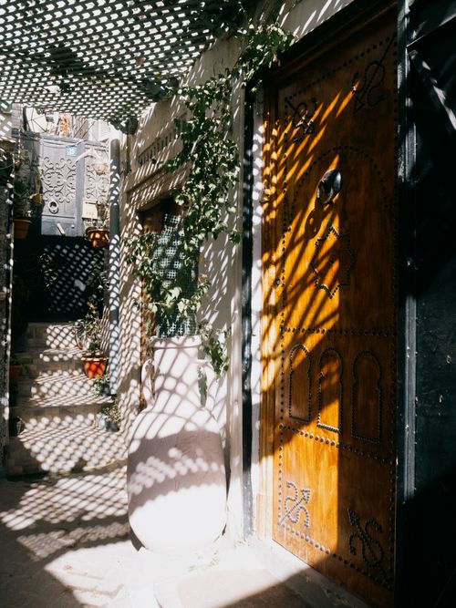Free Captivating shadows on a traditional Tunisian doorway in Tunis, showcasing intricate architecture. Stock Photo
