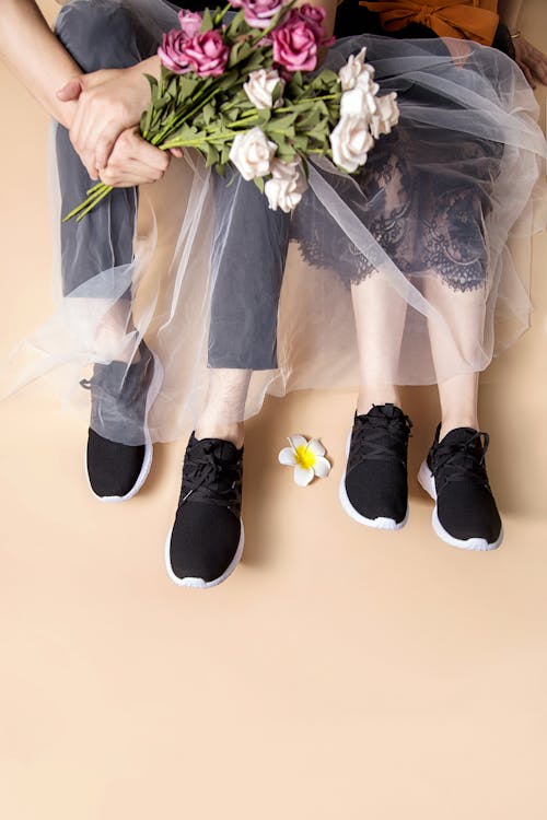 Couple Wearing The Same Black Shoes