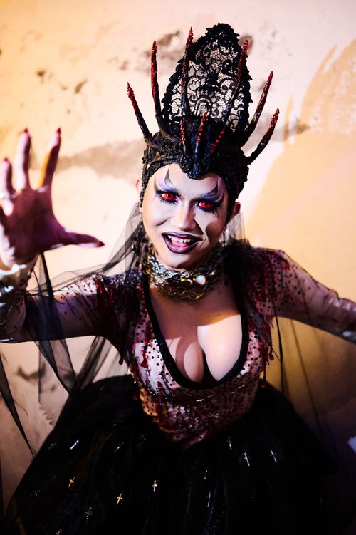 Free Enchanting masquerade portrait of a woman in elaborate costume, exuding dark fantasy and glamour. Stock Photo