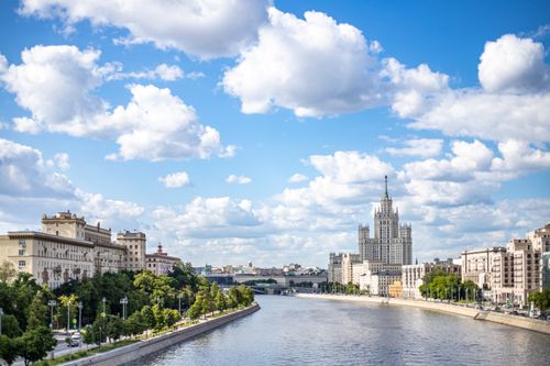 Free Panoramic view of Moscow cityscape featuring the Kotelnicheskaya Embankment against a bright summer sky. Stock Photo