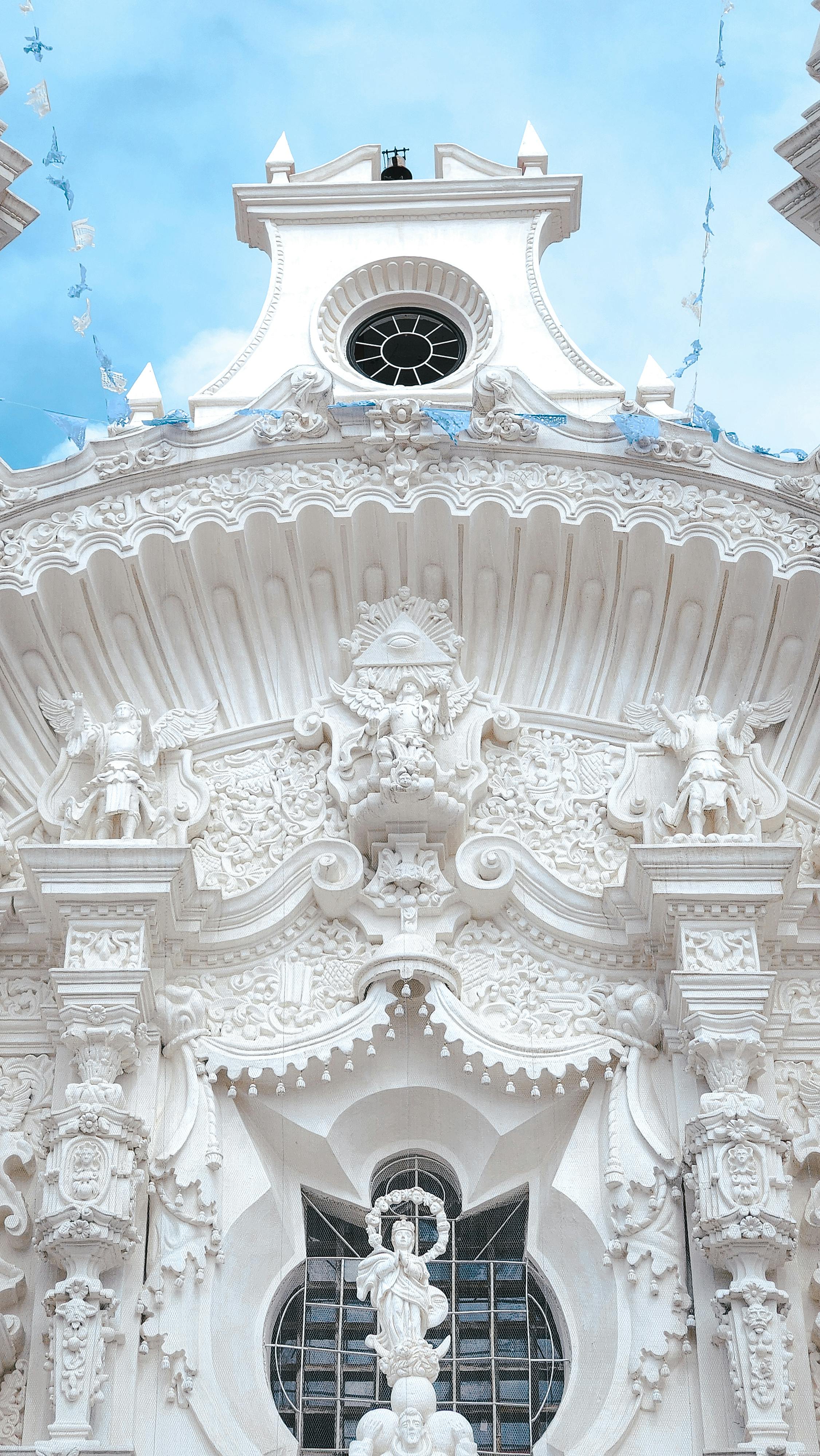 Intricate Baroque church facade in Tlaxcala, Mexico, showcasing ornate design and religious art.