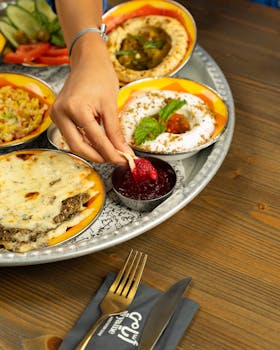 A vibrant platter of Middle Eastern dishes with fresh ingredients and a hint of spice.