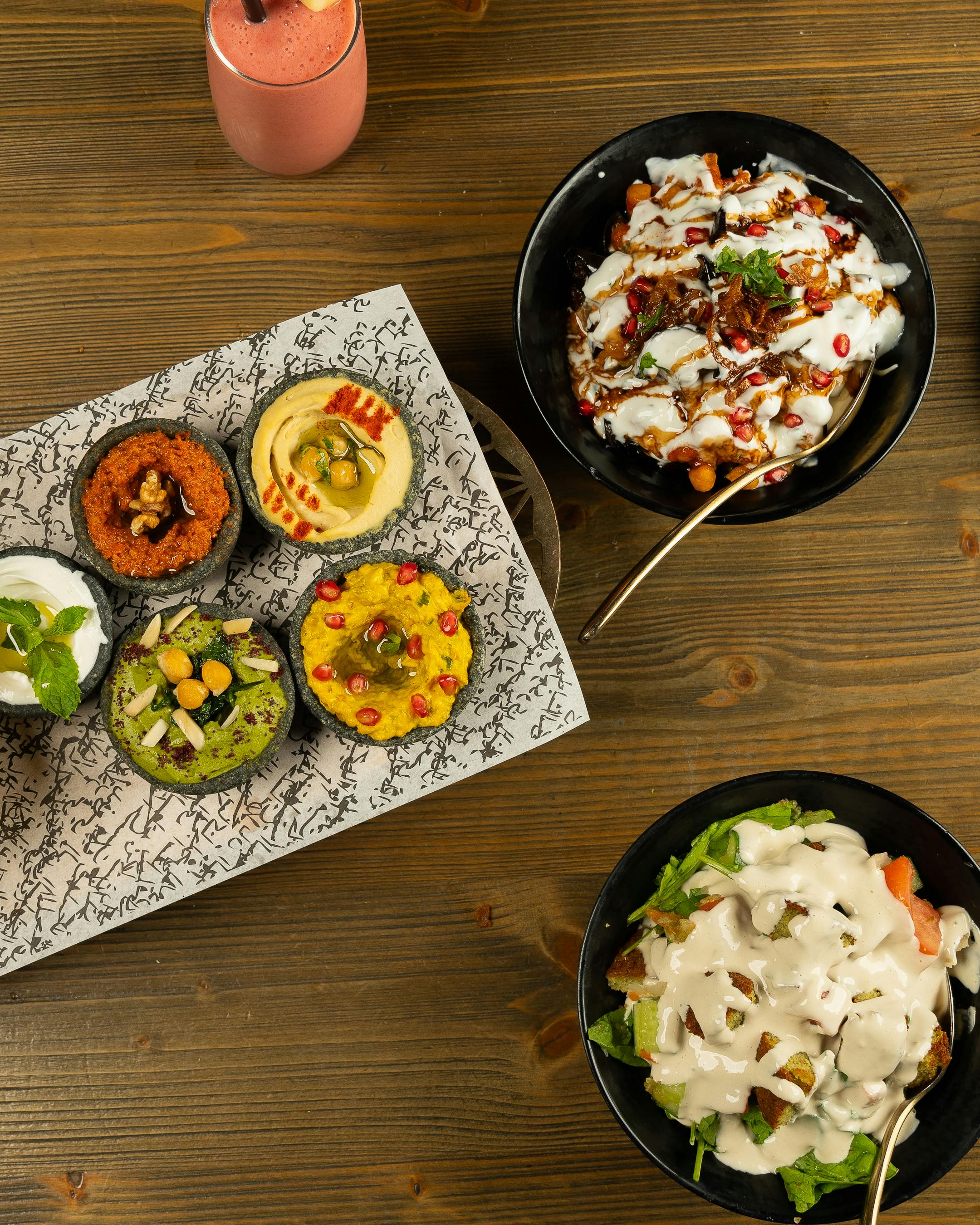 a table with several bowls of food on it