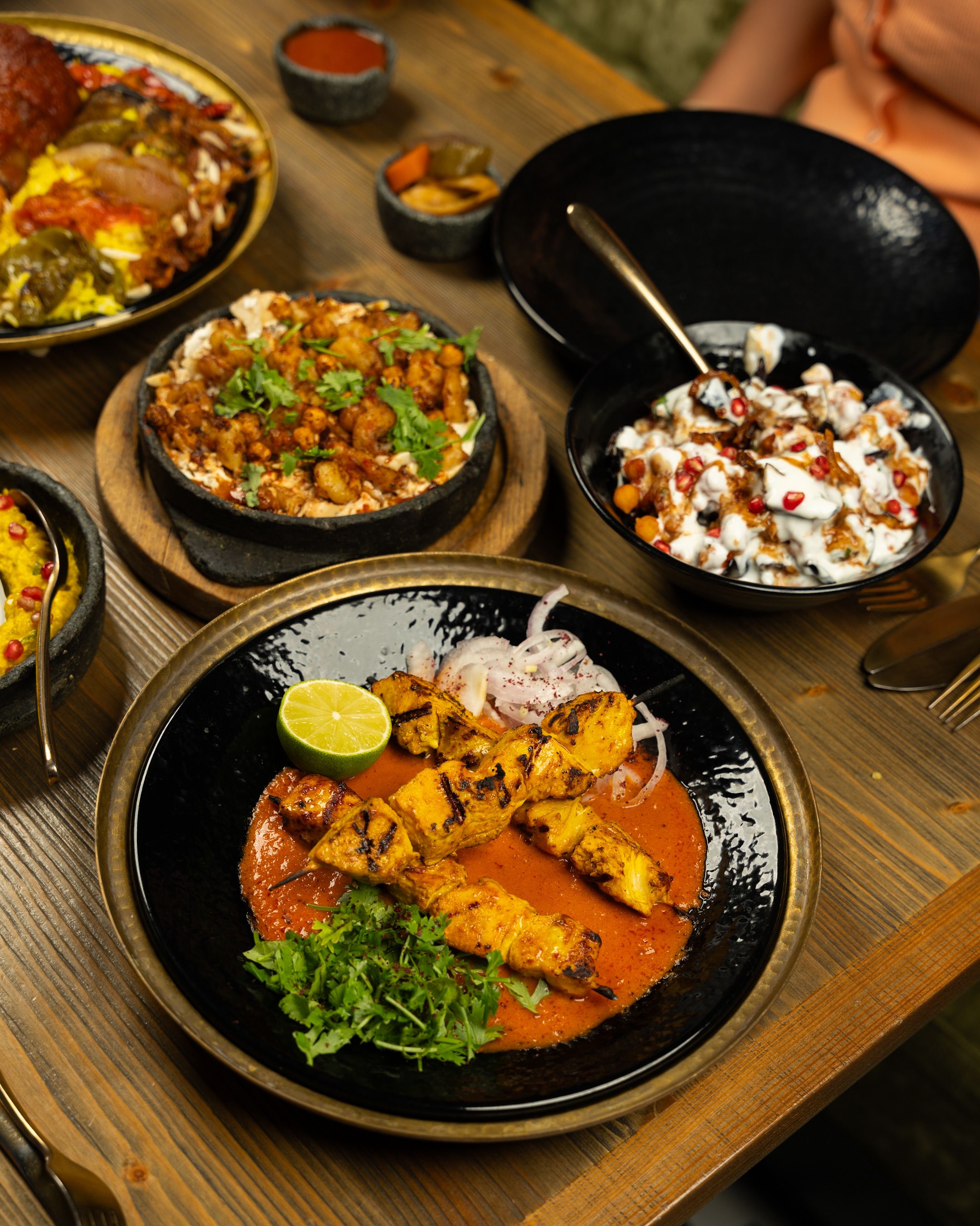 Indian feast with curries naan biryani and grilled dishes