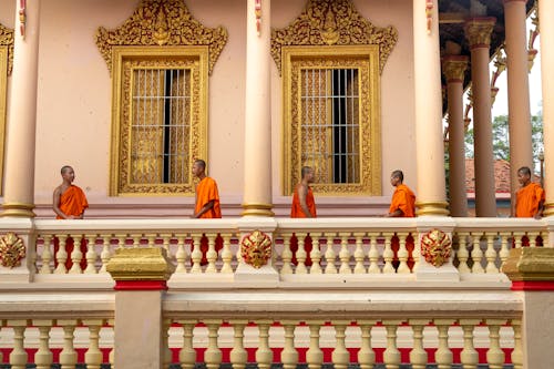 Monks Standing on Porch