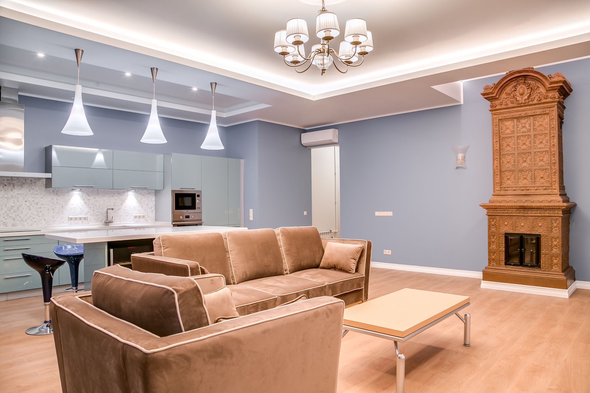Stylish minimalist living room and kitchen with modern furniture and elegant design.