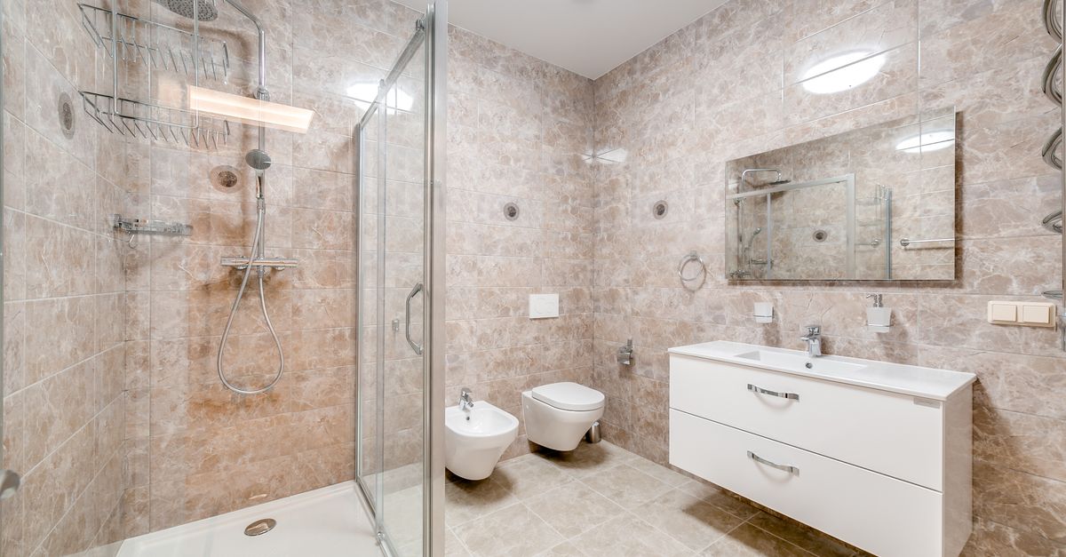 Contemporary bathroom featuring a glass shower and sleek fixtures in a minimalist design.