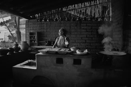 A woman cooking in a traditional Mexican kitchen in Oaxaca, with rustic elements and pottery.