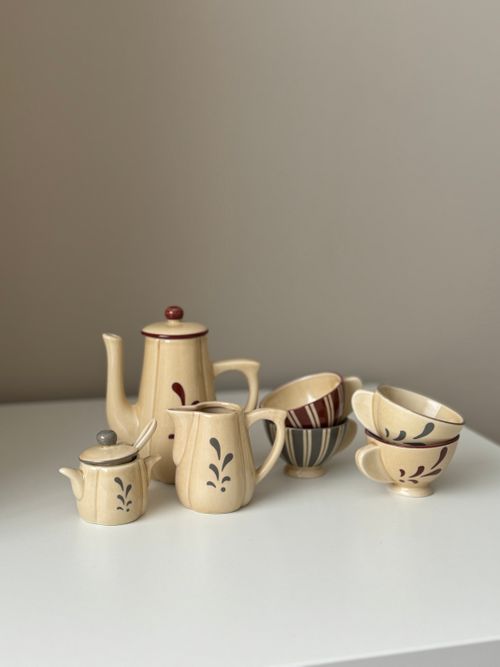 Free Charming vintage porcelain tea set with intricate patterns displayed on a white table, ideal for kitchens or decor. Stock Photo