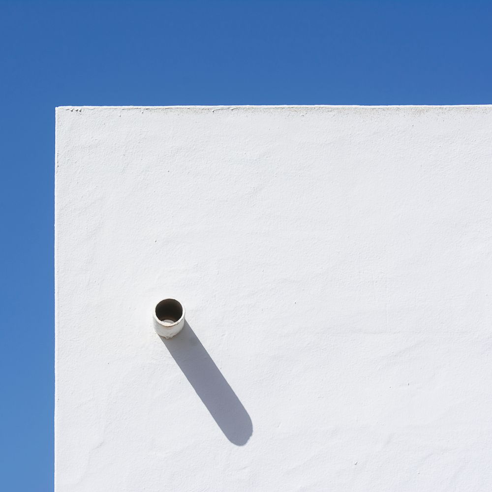 Masonry and Render Painting in Millwall — surfaces prepped and cut in by hand