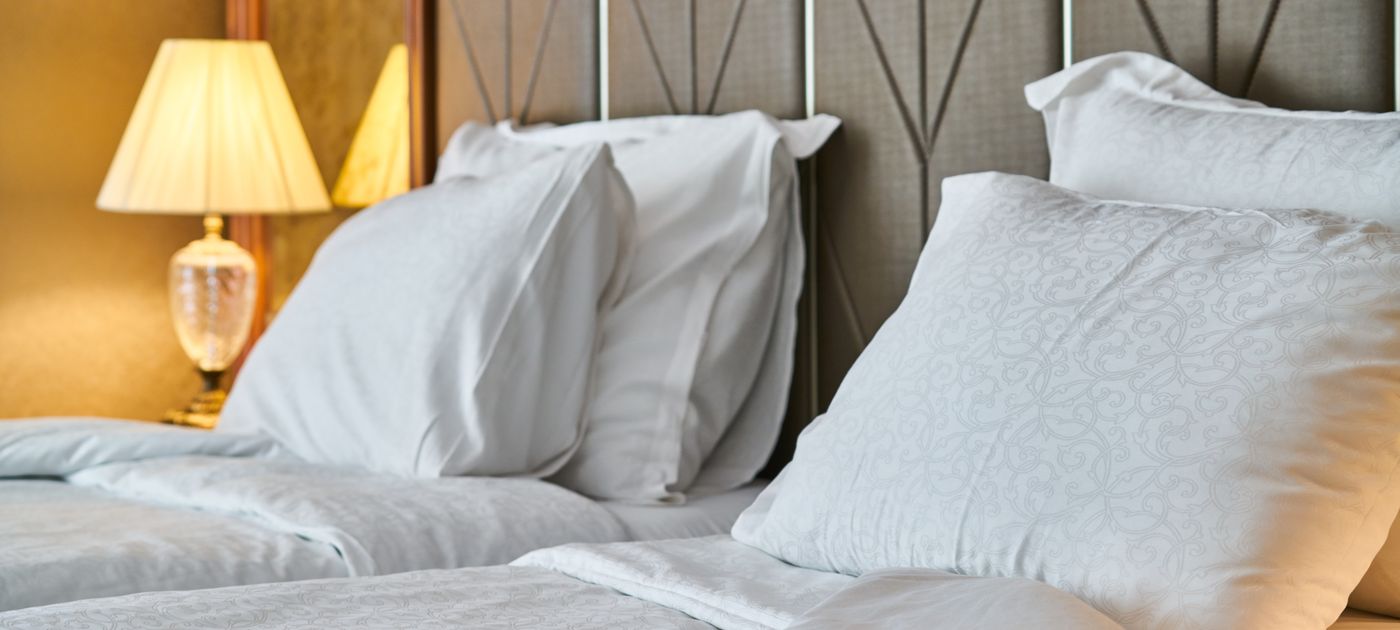 A clean, inviting hotel room — the guest experience a preventive pest programme protects