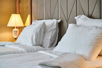 Bedding detail in the room — photo by Engin Akyurt on Pexels