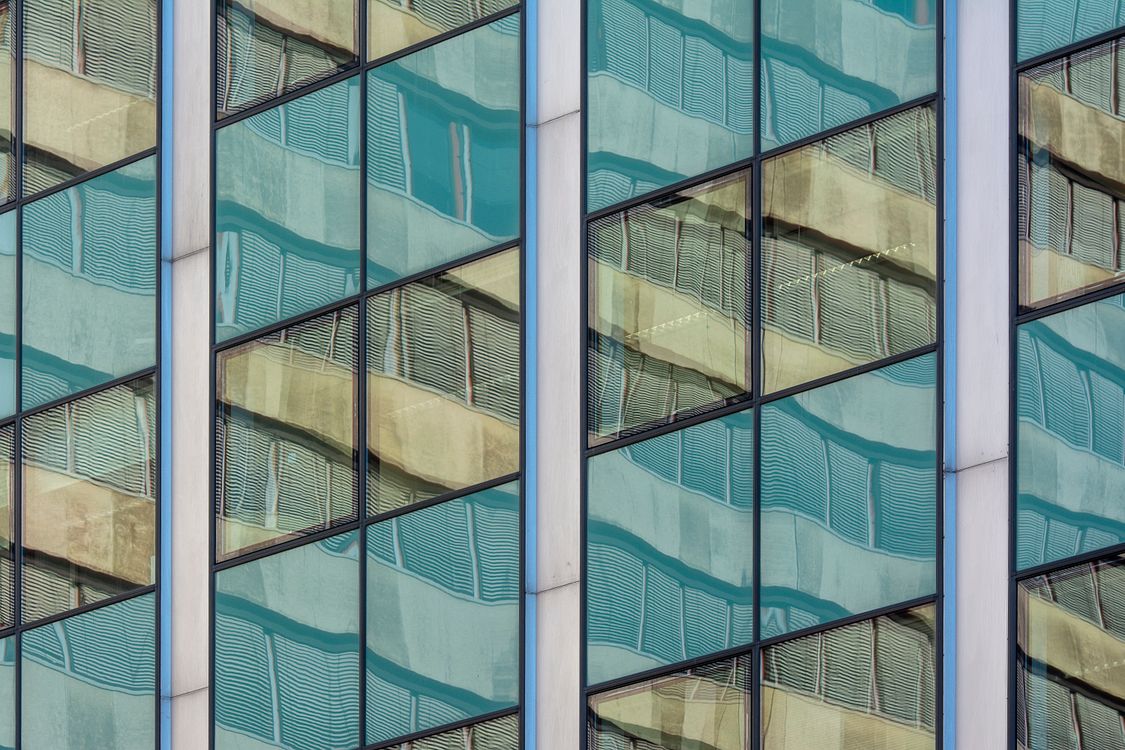 A close up of a building with many windows · Free Stock Photo