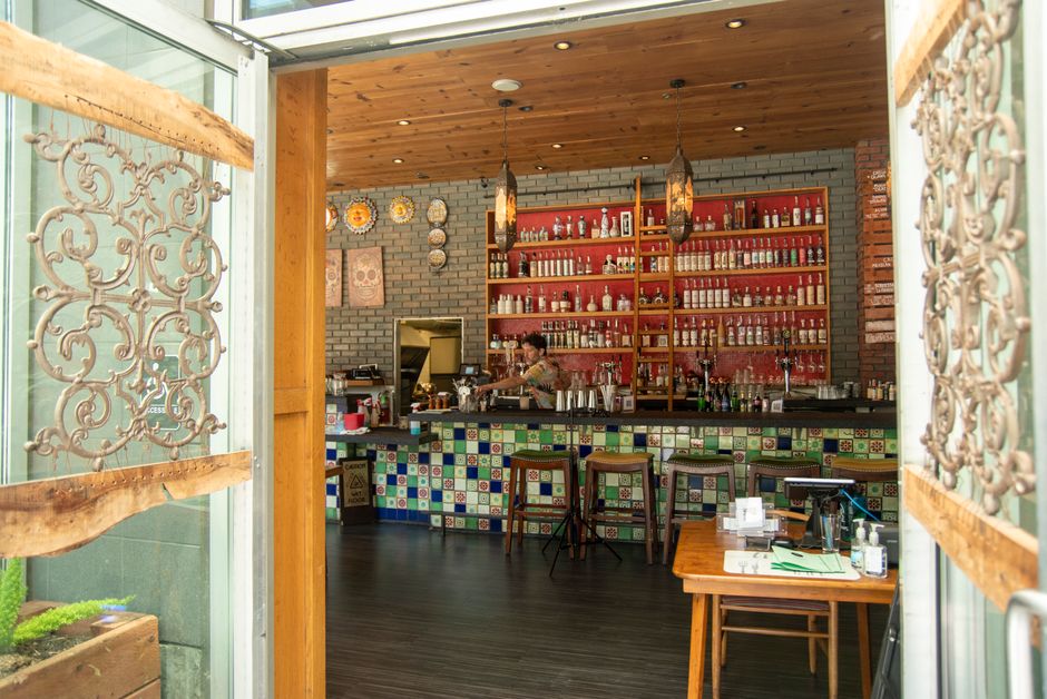 Cozy interior of a traditional Mexican fonda with colorful decor and dining tables.