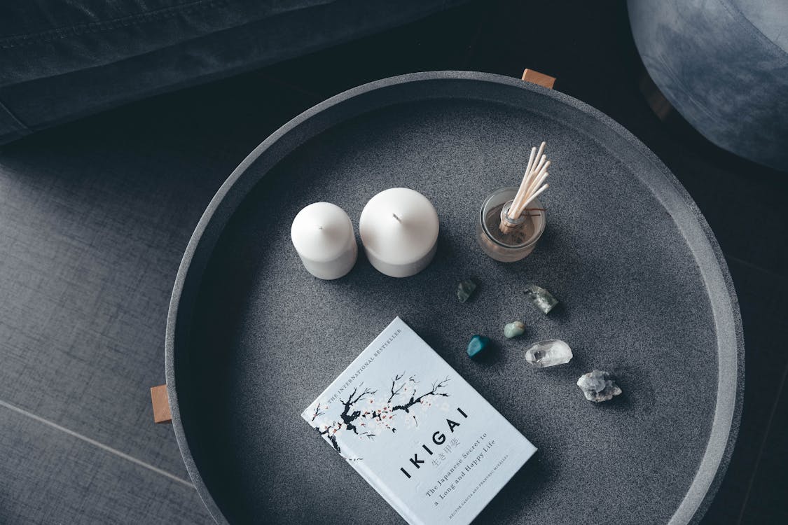 Free Photo of Candles, Stones, and Book  Stock Photo