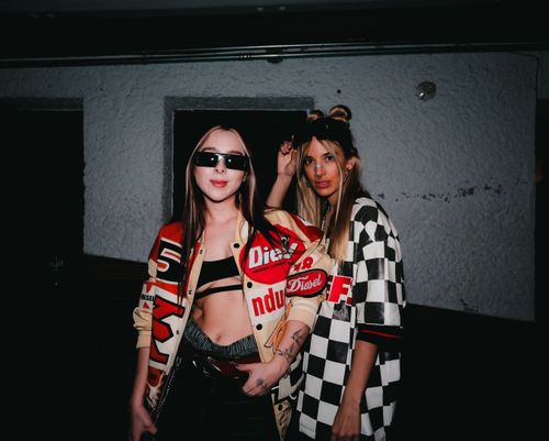 Free Two fashionable women posing indoors with bold streetwear in Ciudad de México. Stock Photo